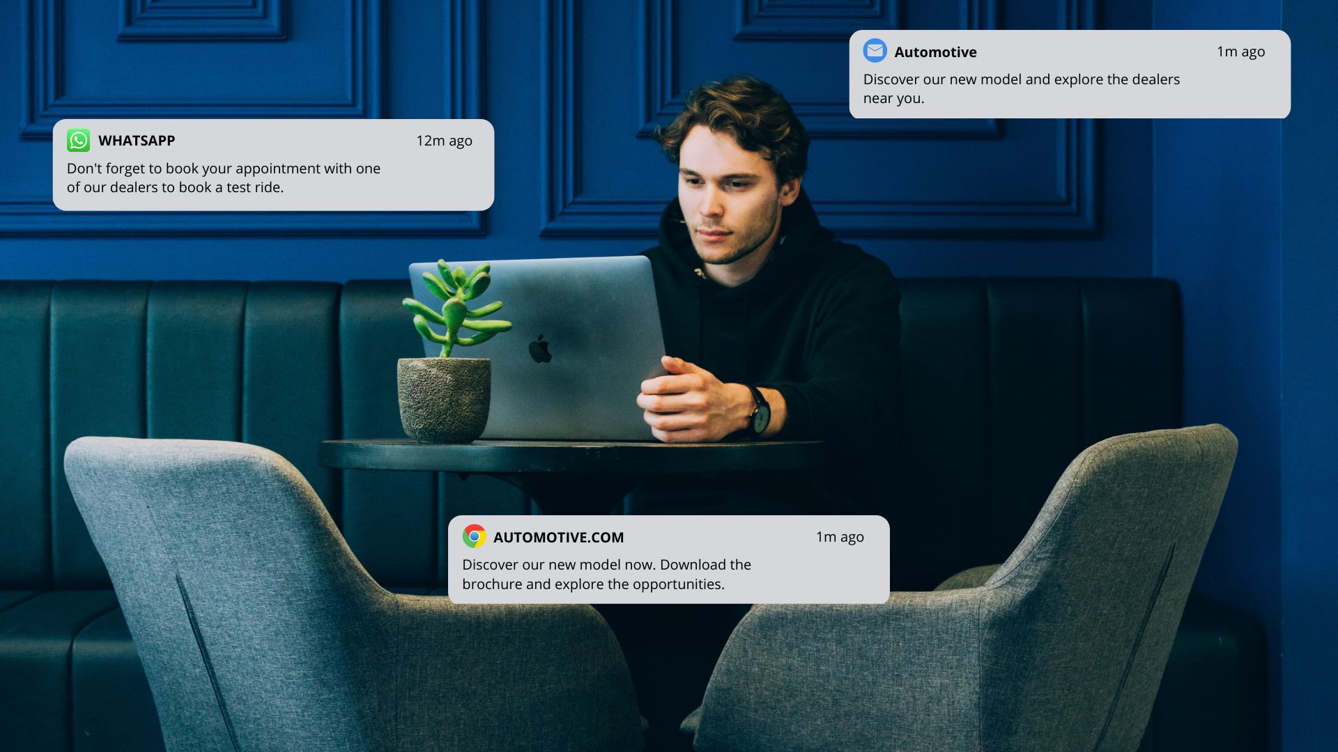  Man in front of laptop with notifications floating around him